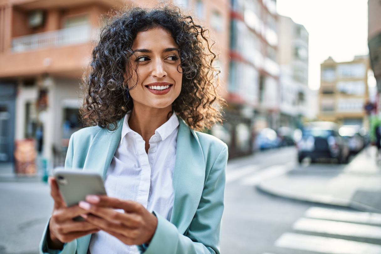 Woman typing on mobile phone