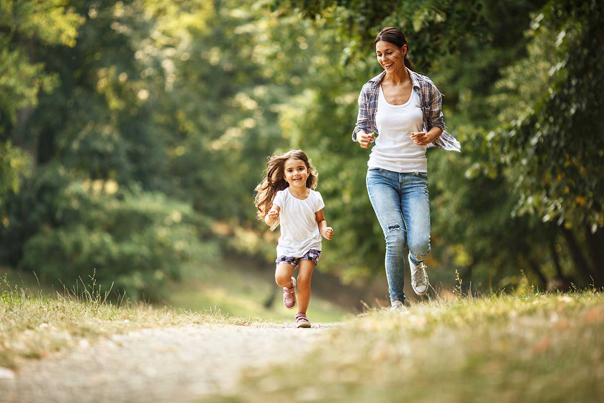 Woman walking with small girl