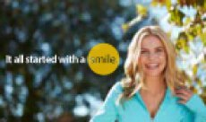 Woman smiling next to type