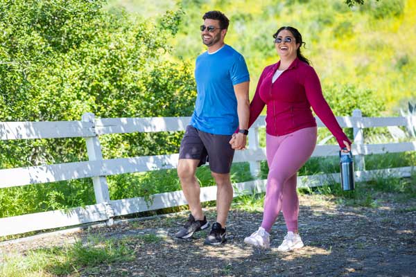 Man and woman walking outside