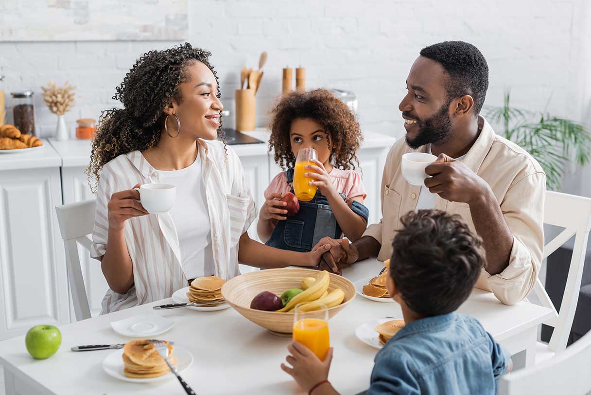 Family eating breakfast together