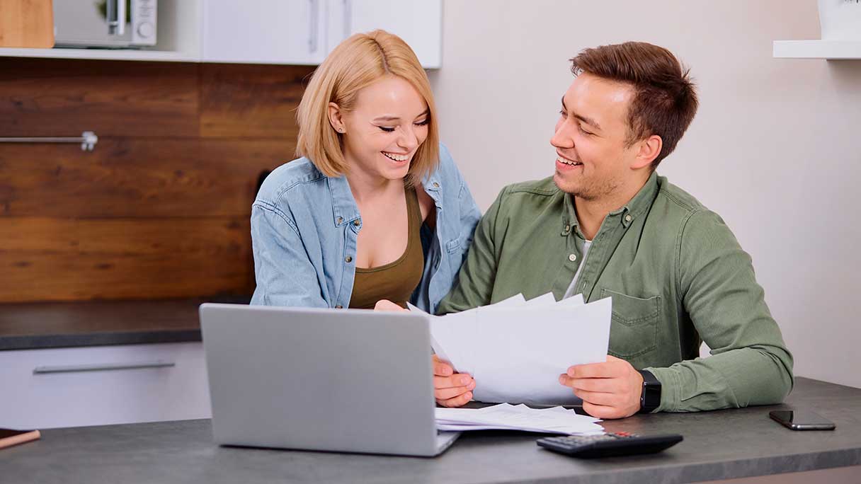 Man and woman looking at a laptop