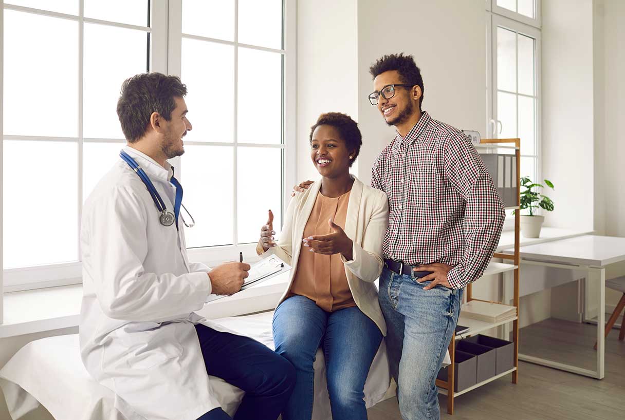 Couple speaking with a doctor