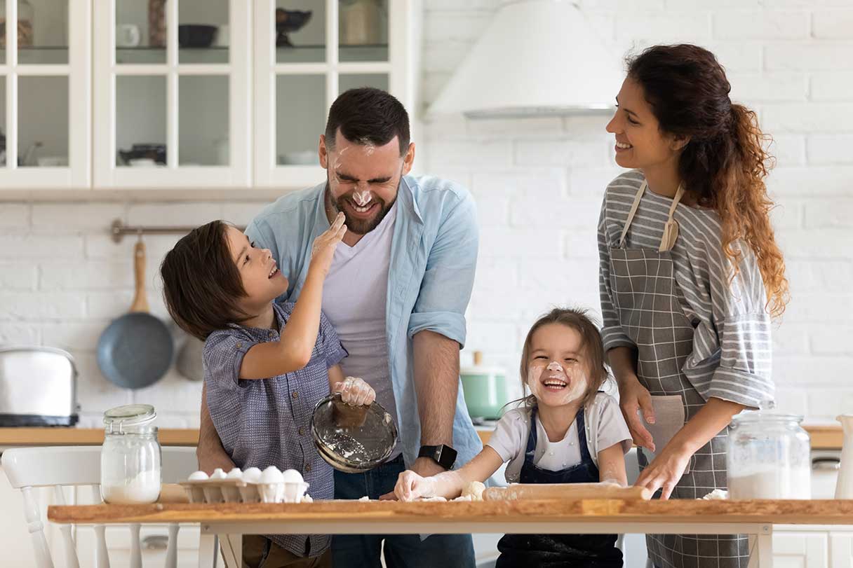 Family baking together in a kitchen