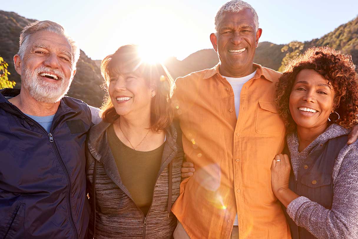 Two couples outside, smiling