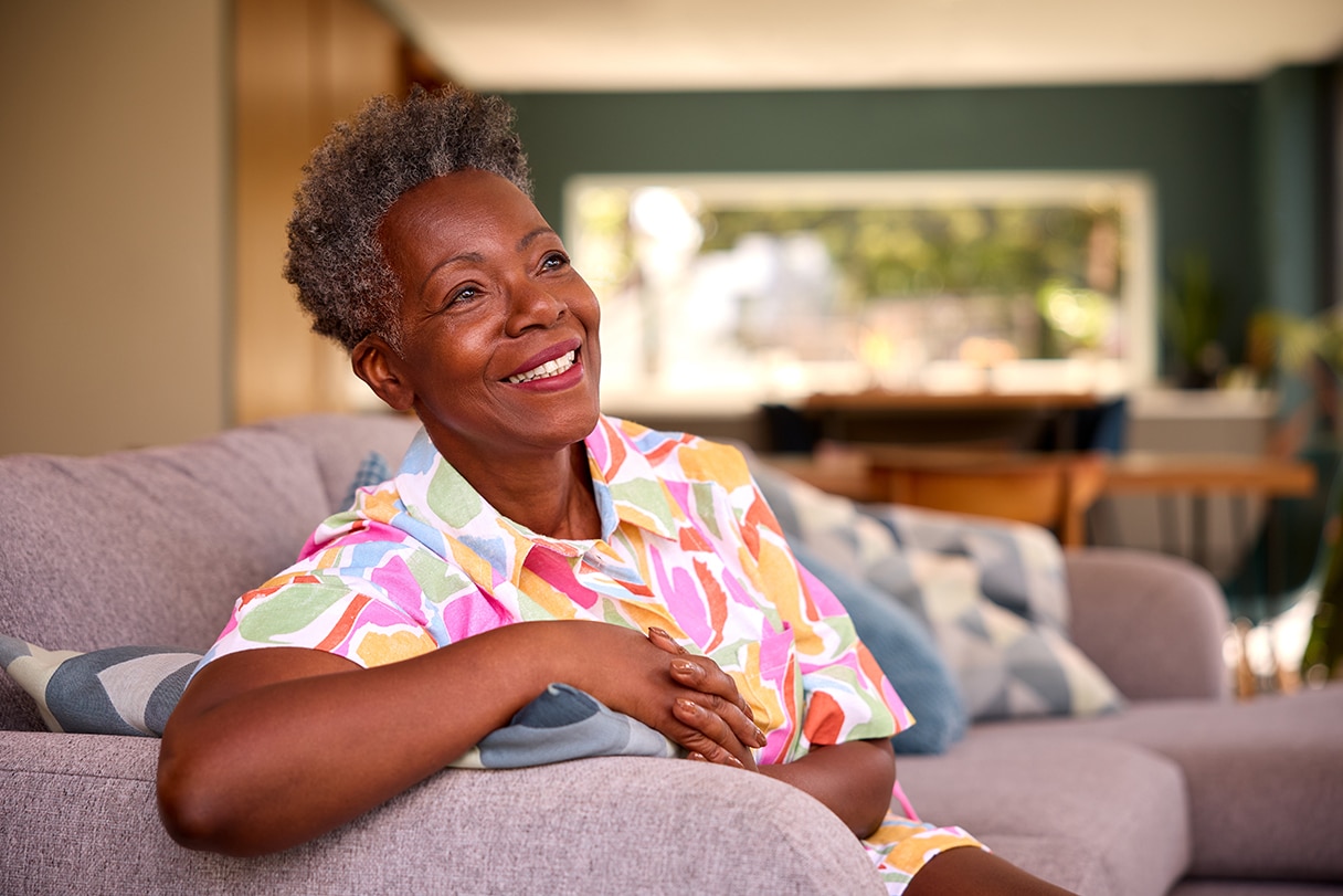 Senior woman sitting on couch