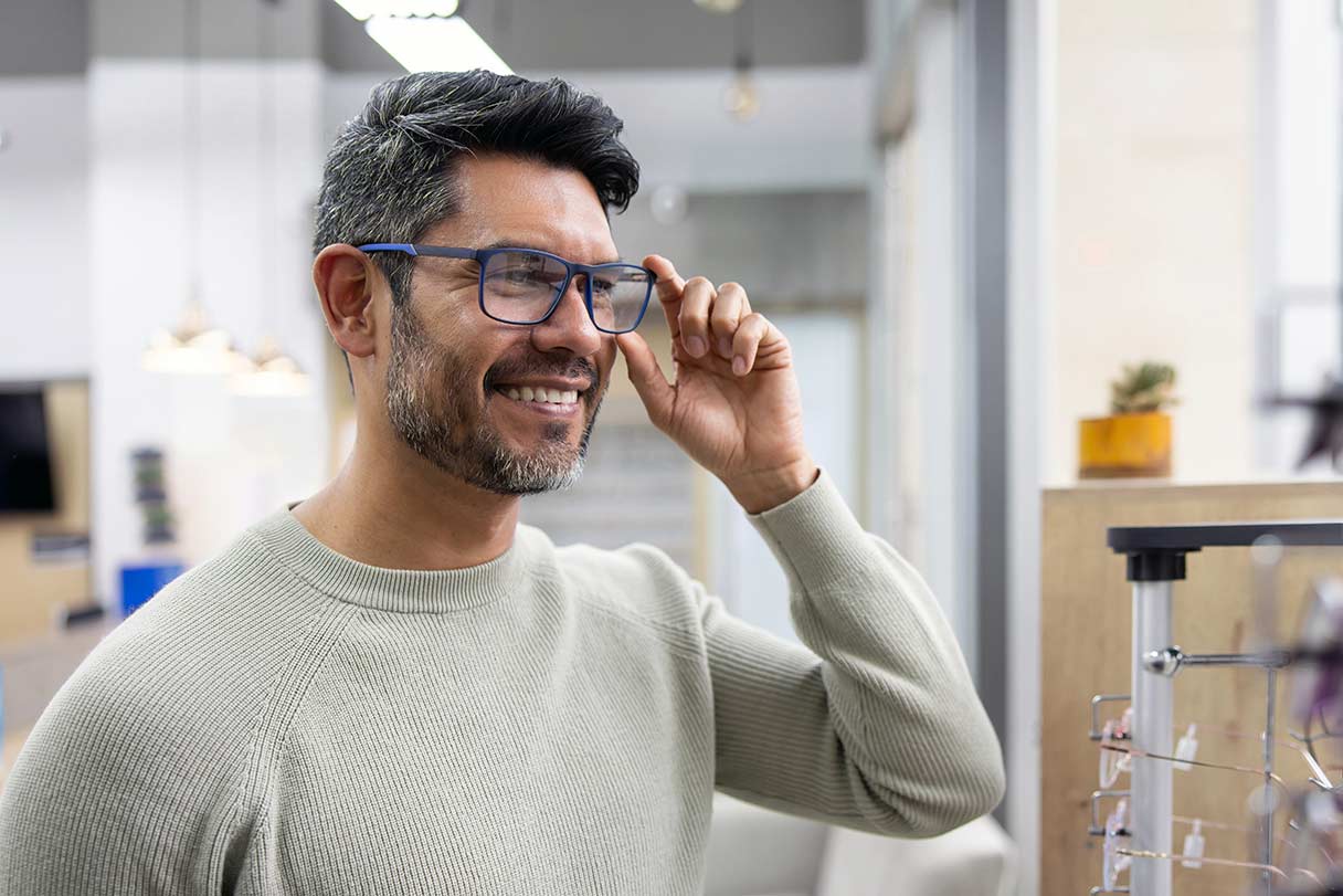 Man trying on glasses