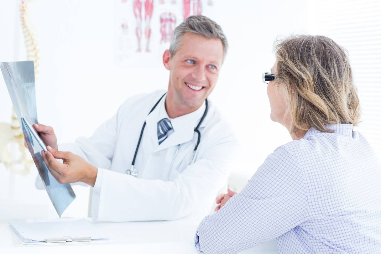 Doctor showing patient an x-ray