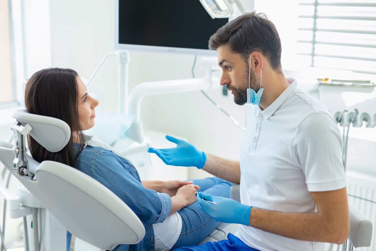 Dentist speaking with a patient