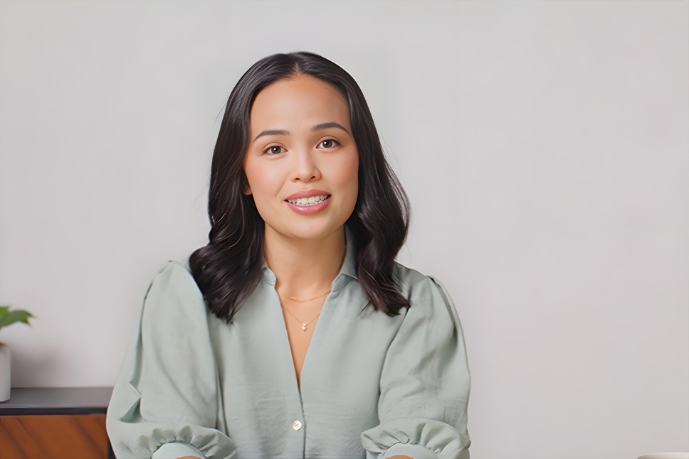 Illustration of man and woman looking at CareCredit credit card under magnifying glass